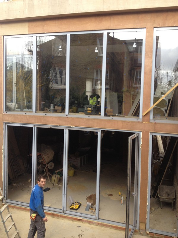 Aluminium bi-fold doors with two-storey glazing in Olympic Park
