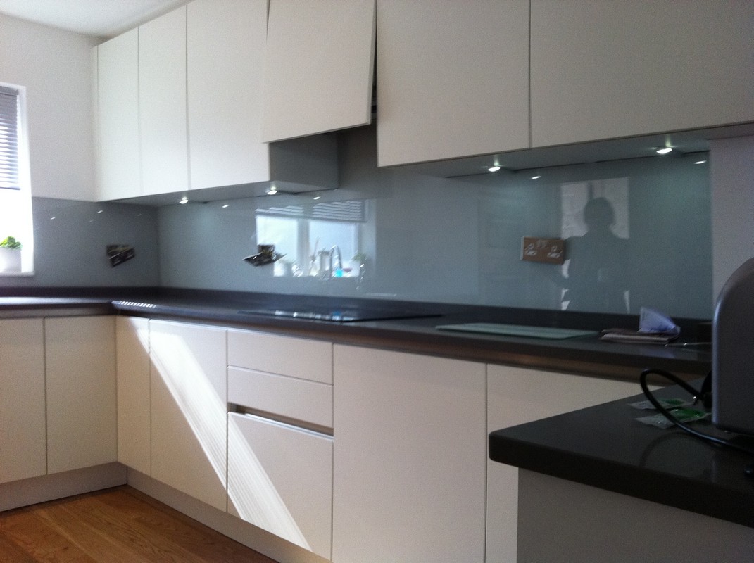 Grey glass kitchen splashback with LED lighting in Olympic Park