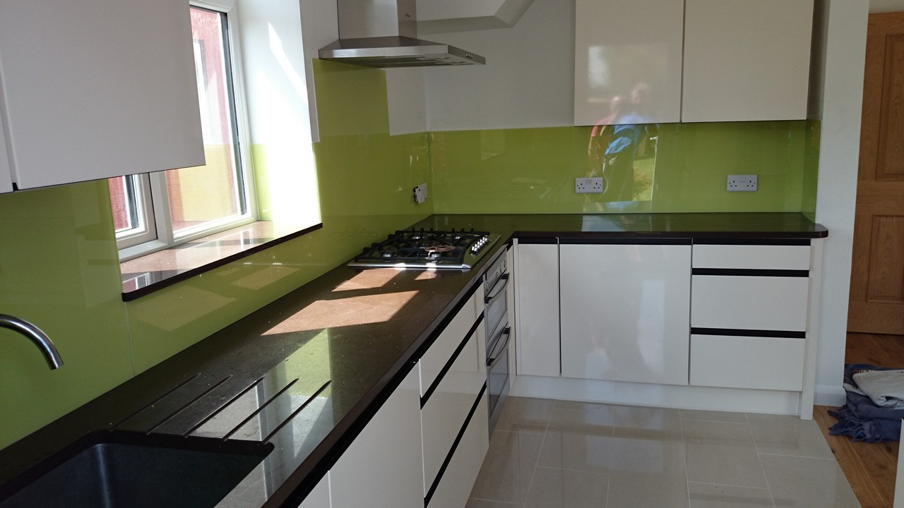 Lime green glass kitchen splashback installed by Olympic Park glaziers