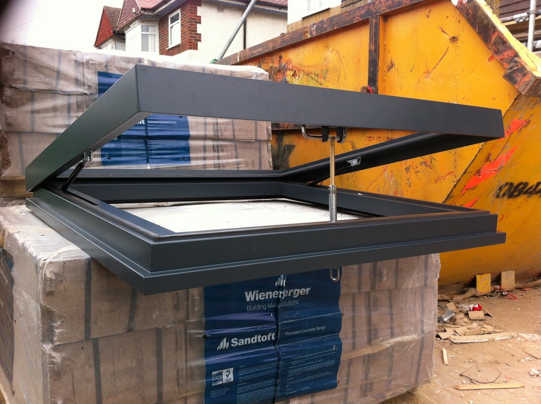 Opening flat roof skylight in anthracite grey installed in Olympic Park
