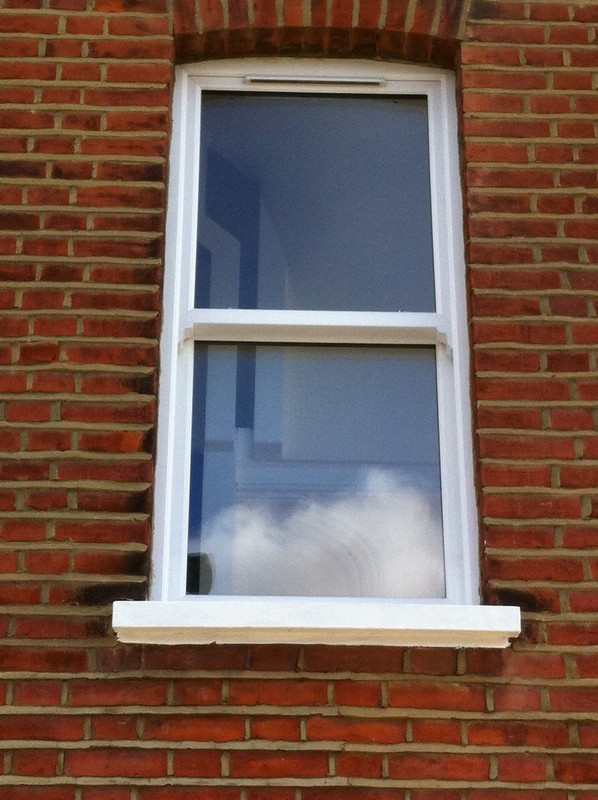 uPVC sash window on Victorian red brick house in Olympic Park